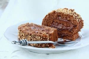 chocolate roulade with chocolate cream on a plate